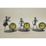 A set of three metal nuts and bolts figural desk clocks in the form of musicians, 5" high