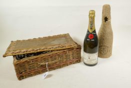 A bottle of 1955 Moet & Chandon Brut Imperial Champagne, with a Moet branded rattan hamper, 12" high