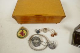 A wooden musical jewellery box containing various hallmarked silver jewellery