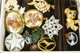 A box of good quality costume brooches etc, including jade, mother of pearl etc