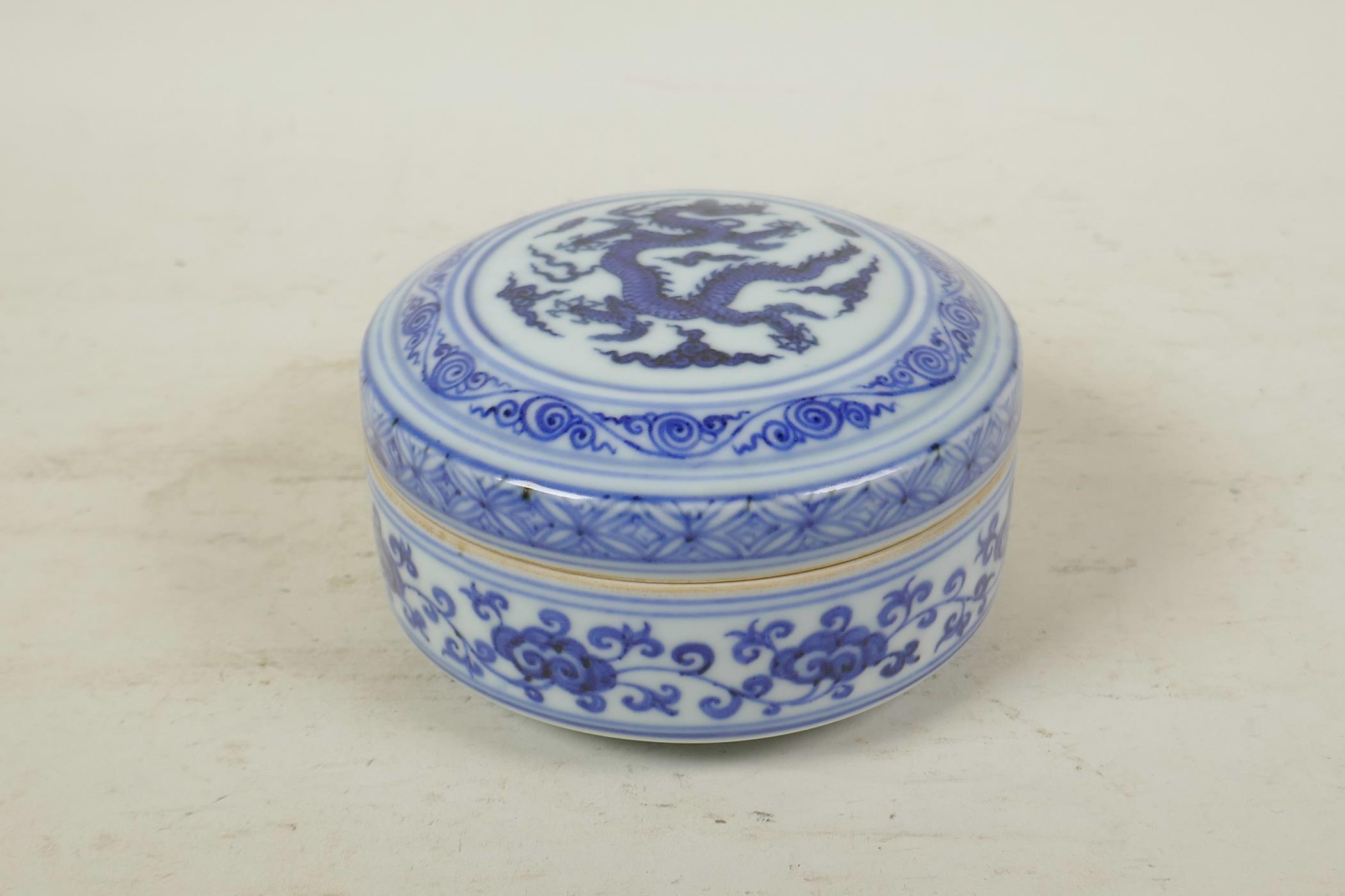 A Chinese blue and white porcelain cylinder box and cover with dragon decoration to cover, 6