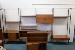 A mid-century 'Avalon' teak modular free standing wall unit comprising six sections and a shelf, 72"