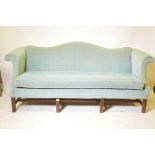 A Chippendale style hump back settee, with scroll arms raised on moulded supports, 80" wide