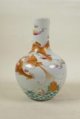 A Chinese polychrome porcelain vase decorated with an iron red and gilt dragon in flight, seal