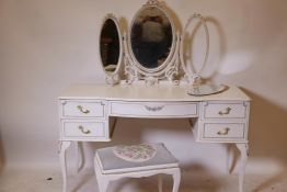 A painted serpentine front five drawer dressing table with triptych mirror and matching stool, 52" x