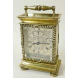 An unusual brass cased carriage style mantel clock with late C18th/early C19th watch movement and