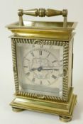 An unusual brass cased carriage style mantel clock with late C18th/early C19th watch movement and
