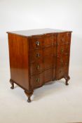 A good late C19th/earlyC20th burr walnut shaped front chest of four long drawers, with brass drop
