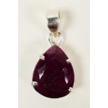 A distinctive pendant featuring a 15ct pear cut natural red ruby set in sterling silver, hallmarked,
