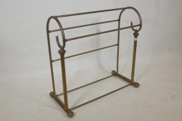 A Victorian style brass towel rail, 29" high, 29" wide, 11" deep