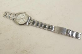 A stainless steel designer wristwatch, strap broken