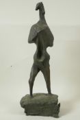 A modernist bronze standing figure on a block plinth base, 17" high