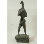 A modernist bronze standing figure on a block plinth base, 17" high