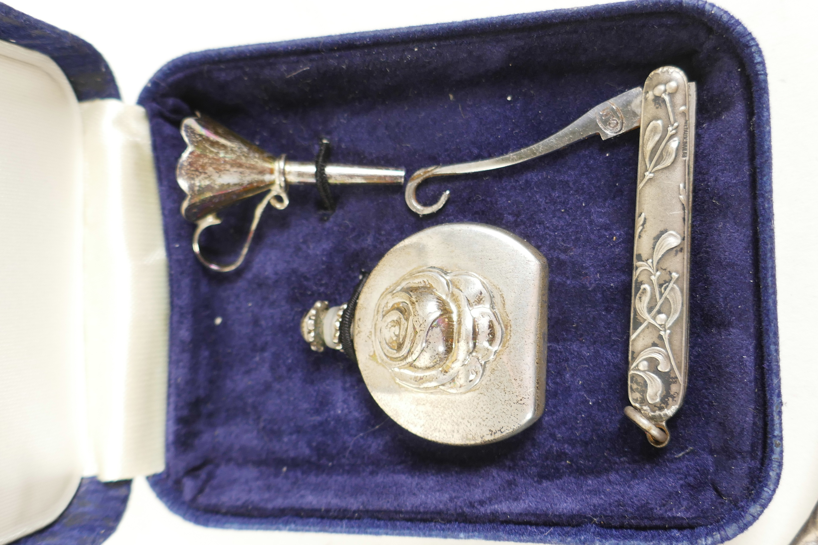 An embossed silver cherub hand mirror together with a silver perfume flask and funnel, and a - Image 3 of 4