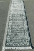 A silver grey ground full pile Turkish runner decorated with a floral medallion design, 40" x 158"