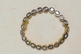 A silver gilt and uncut diamond set bracelet, 7" long