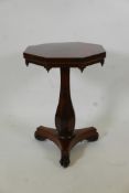 A William IV rosewood occasional table, with octaganol top and carved frieze with drop finials,