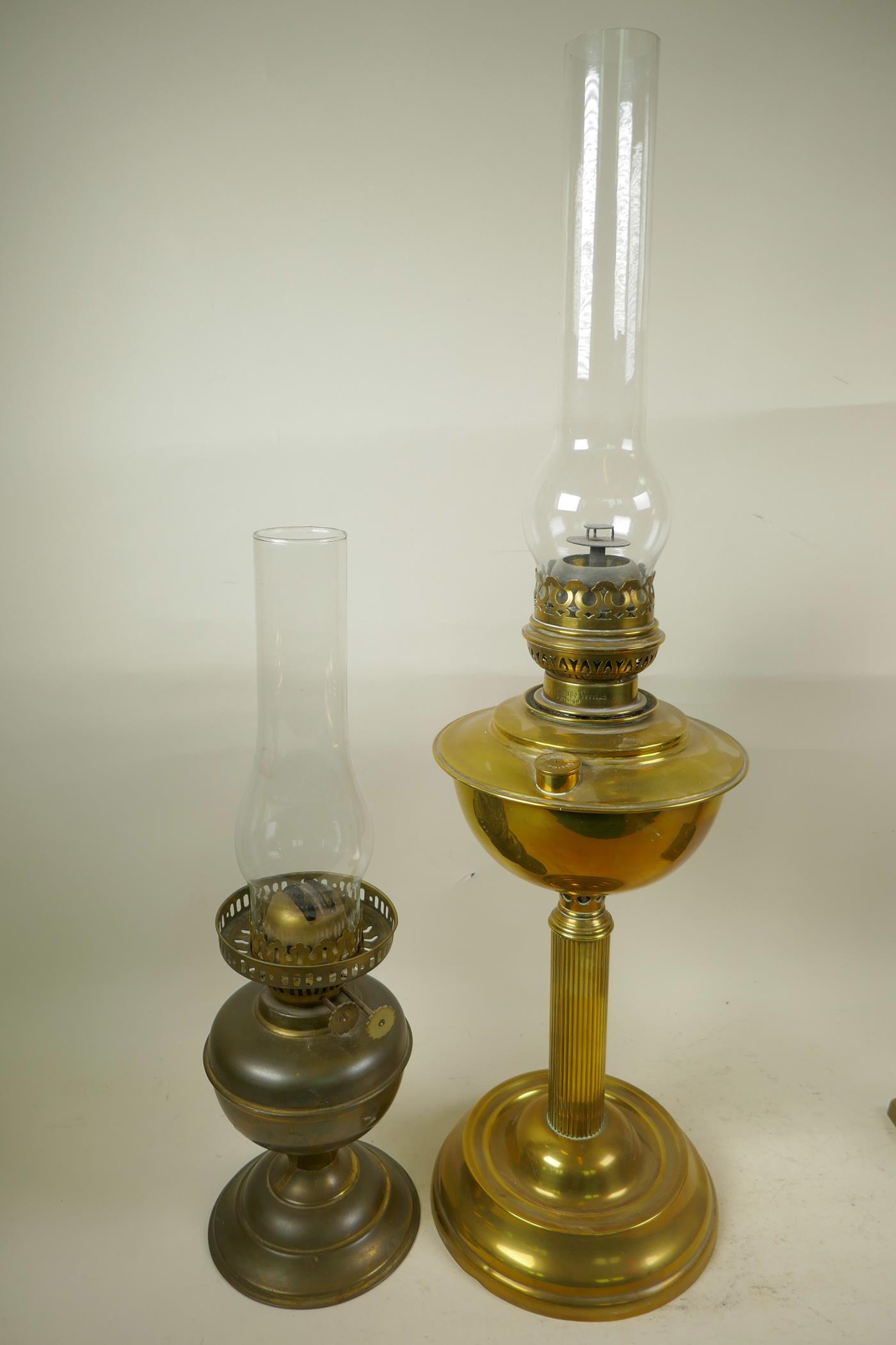 Three late Victorian brass oil lamp burners including glass chimneys, two beautifully cast in a - Image 5 of 6