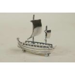 A novelty 925 silver miniature boat, 1½" long