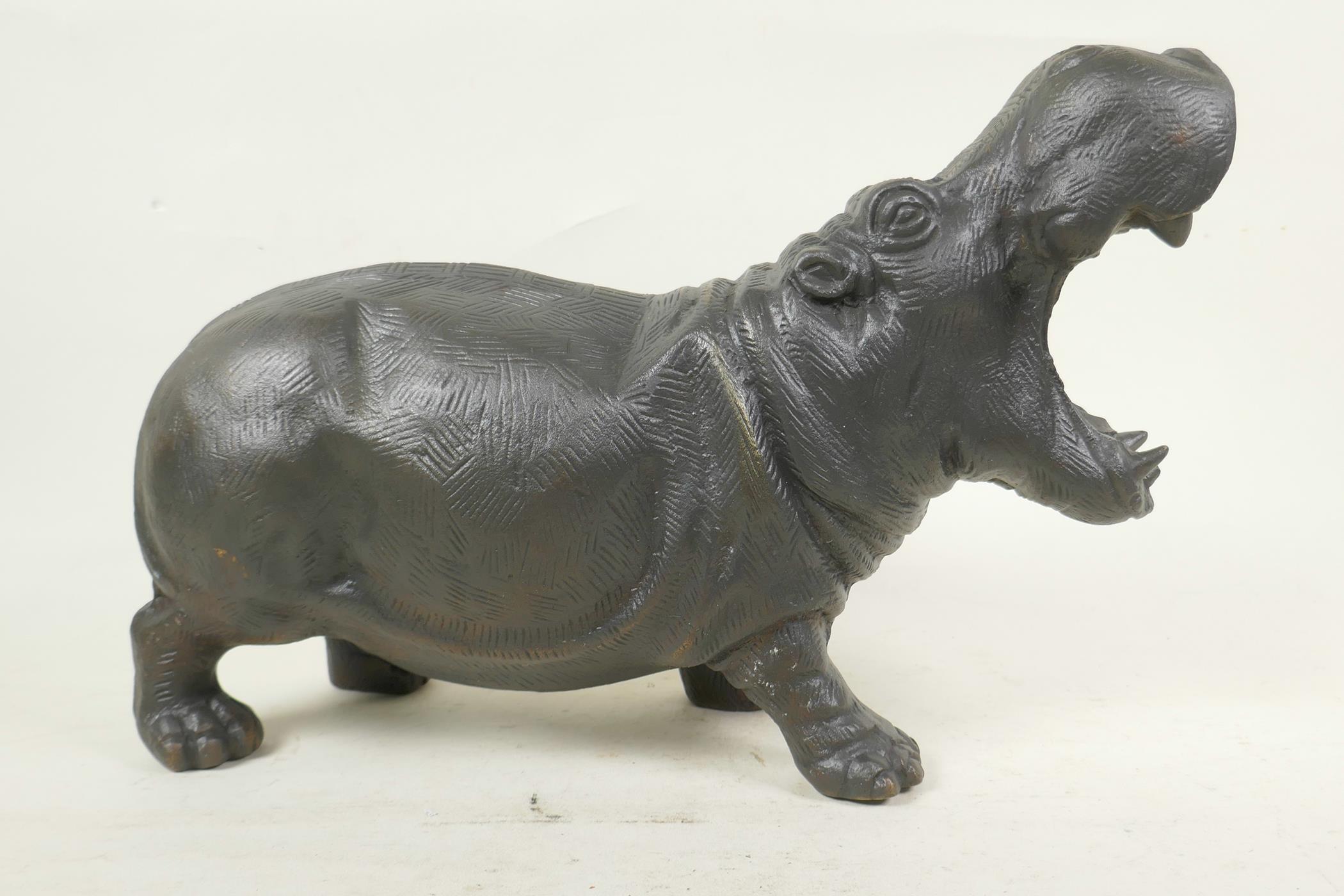 A cast bronze figure of a hippopotamus, 14" long