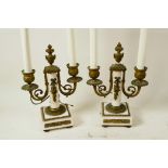 A pair of French marble and ormolu two light table candelabra of classical form, converted to