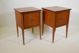 A pair of satinwood filing cabinets with crossbanded inlay, raised on square tapering supports, by