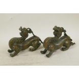 A pair of Chinese bronze figures of kylin, 8" long