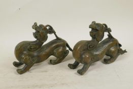 A pair of Chinese bronze figures of kylin, 8" long