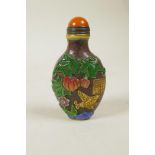 A Chinese Peking glass snuff bottle with raised and enamelled decoration of butterflies, gourds,