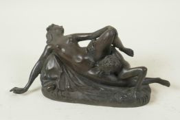 An erotic bronze figure of a nude and Satan, 8½" long