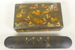 An Indo-Persian papier mache cigarette or card box decorated with a tiger hunting deer and