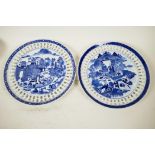 A pair of Chinese blue and white ribbon plates decorated with figures and buildings in a