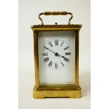 A French C19th brass cased repeated carriage clock by R. & C. Paris, a full glazed corniche case