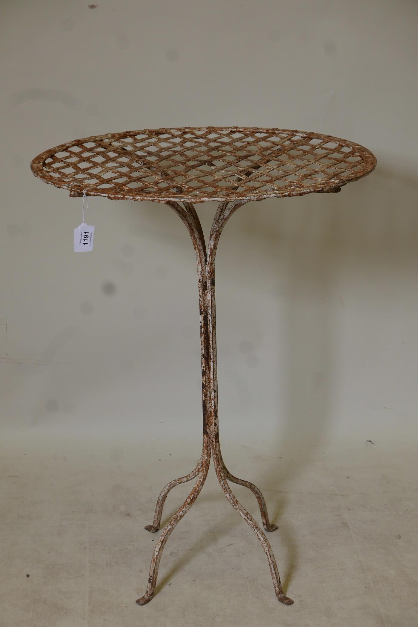 A vintage French painted wrought iron bistro table, 22" diameter x 30" high