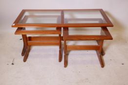 A nest of 3 mahogany occasional tables with inset bevelled glass tops, 43" x 20" x 18"