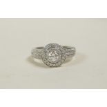 A 9ct white gold diamond cluster ring, approximately 70 points, approximate size 'M'