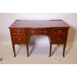 A C19th Maple & Co Ltd five drawer mahogany kneehole dressing table, with bow fronted middle and