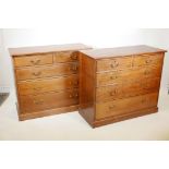 A pair of early C20th Waring and Gillows oak chest of two short over three graduated drawers