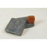 A Chinese soapstone seal in a hardstone box, the lid with carved Quan Yin decoration, 2½" x 2½"