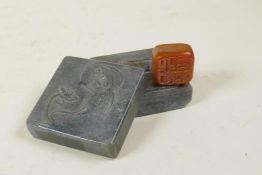 A Chinese soapstone seal in a hardstone box, the lid with carved Quan Yin decoration, 2½" x 2½"