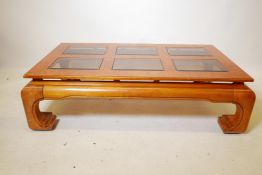 An oriental elm coffee table with six inset glass panels, 30" x 52", 14" high
