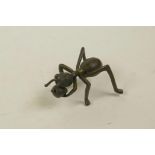 A Japanese Jizai style bronze incense stick holder in the form of an ant, 2" long