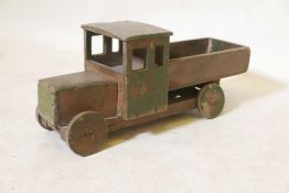 A vintage painted wood model toy tipper truck, 16" long