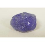 A 12.54ct blue tanzanite, rough cut, IDT certified, with certificate