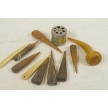 A box of hand carved weaving pegs and a vintage needle gauge and knitting recorder