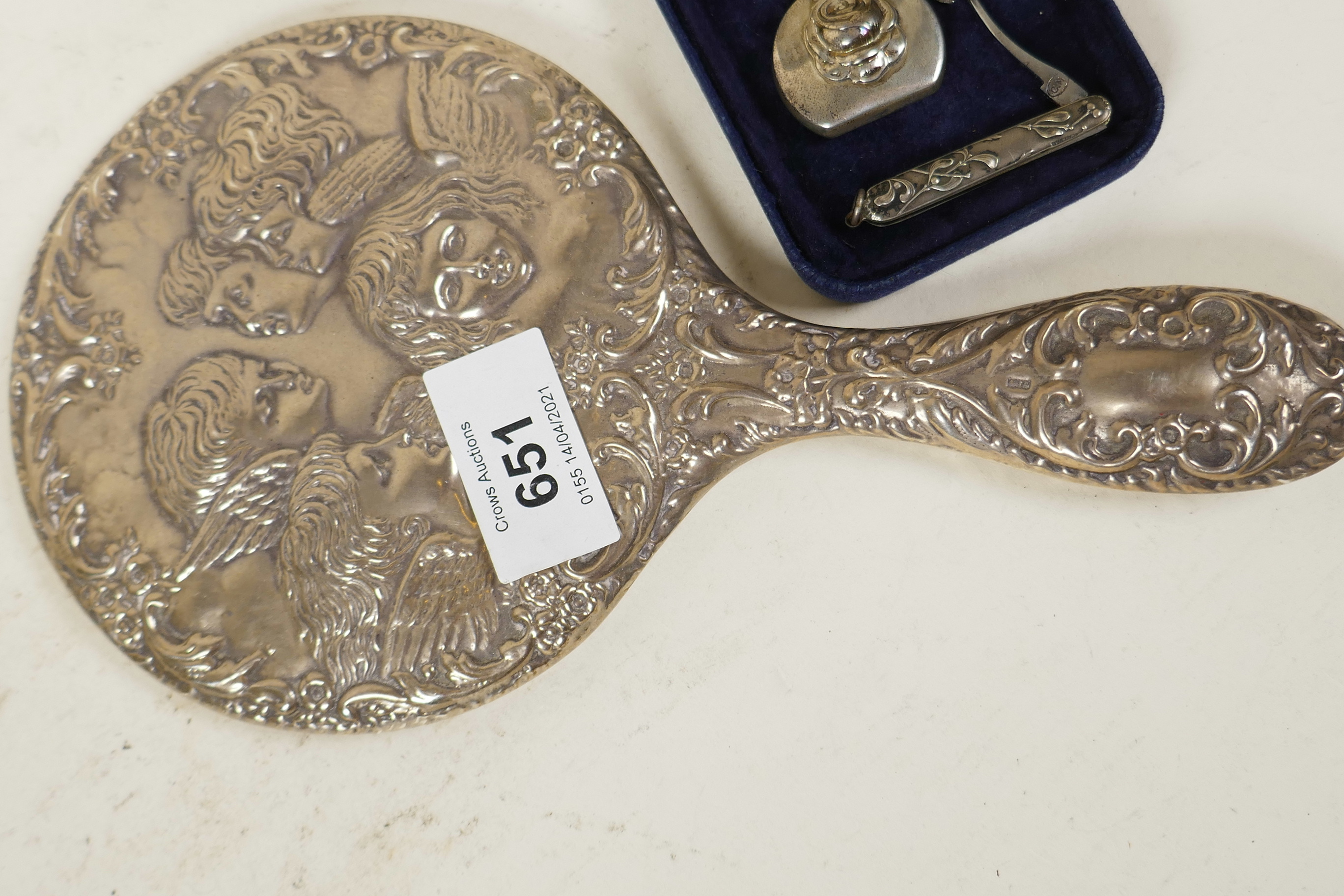 An embossed silver cherub hand mirror together with a silver perfume flask and funnel, and a - Image 2 of 4