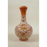 A Chinese red and white porcelain garlic head shaped vase decorated with lotus flowers, auspicious