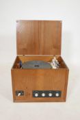 A 1960s Garrard 'Model 4HF (H)' record player in a teak cabinet, with a spare needle arm, 20" x 15",