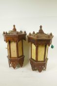 A pair of Oriental hardwood pendant lanterns of hexagonal form, converted for electricity, A/F, 17½"