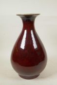 A Chinese flambe glazed pottery pear shaped vase, 13" high